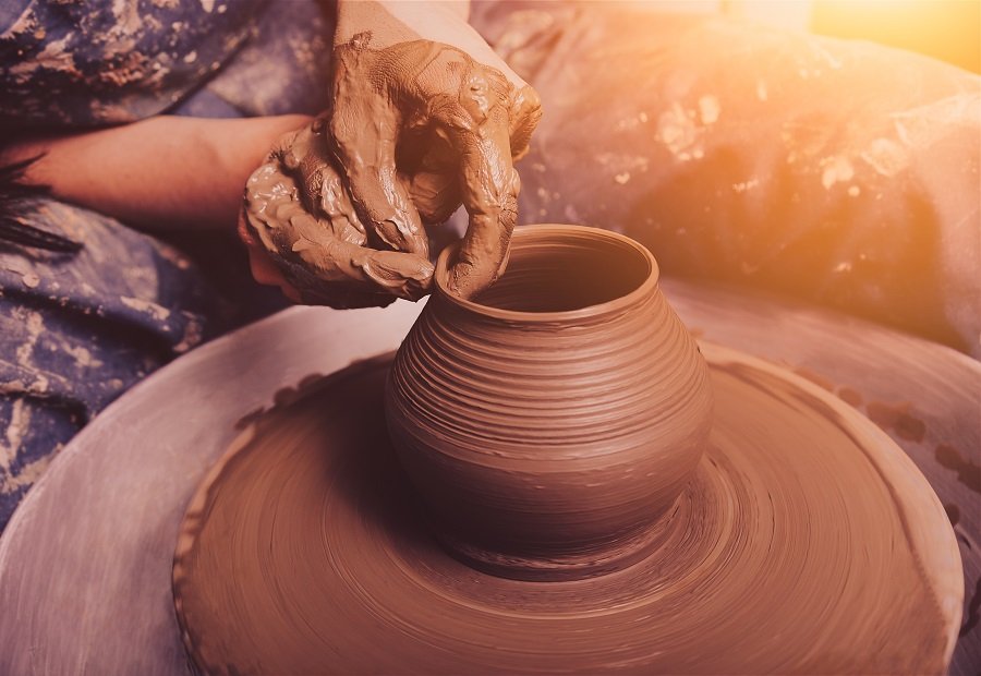 working on pottery wheel